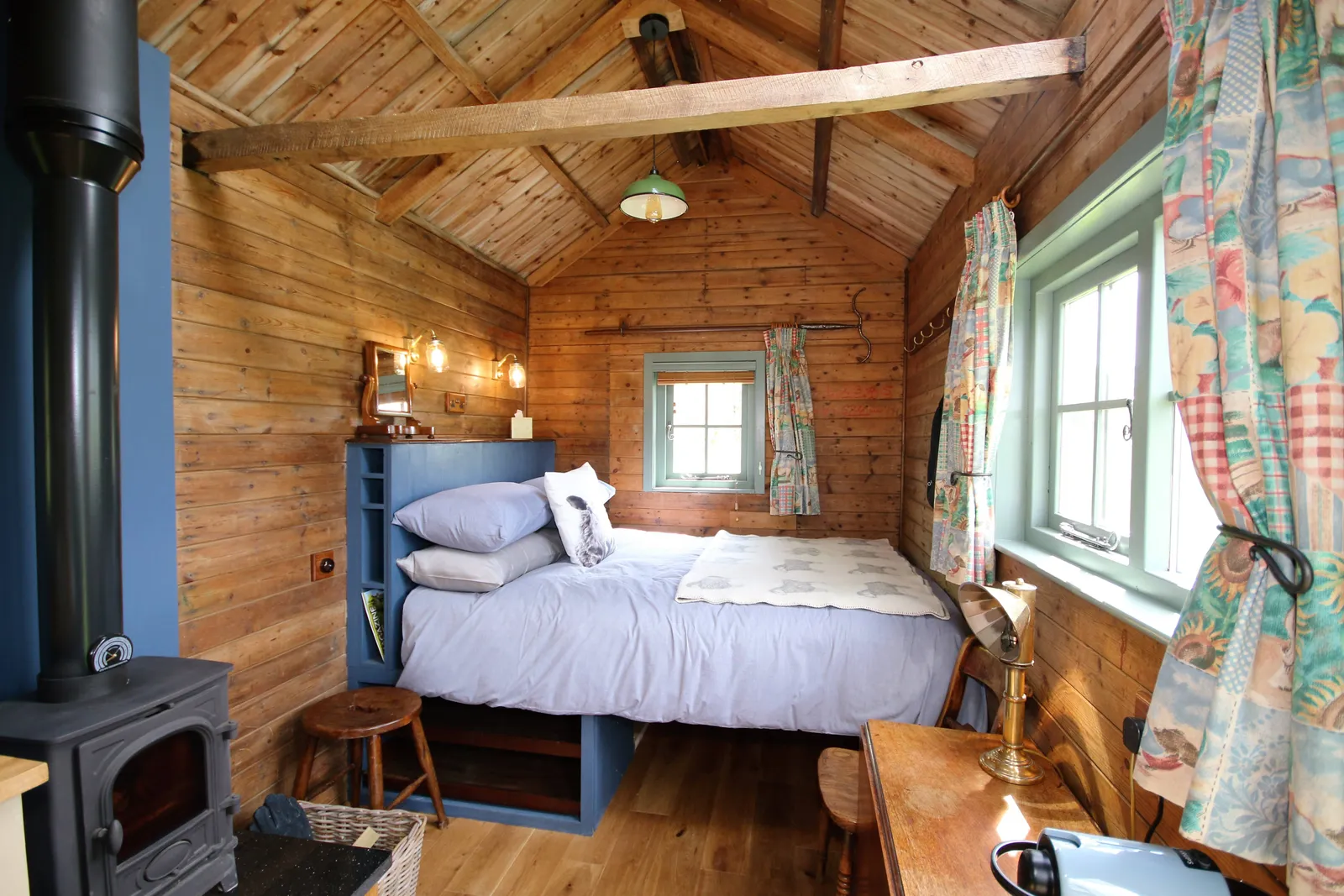 Greenhill glampings Kingsize bed with views out to the meadow.