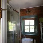 The Shepherds hut ensuite shower and basin
